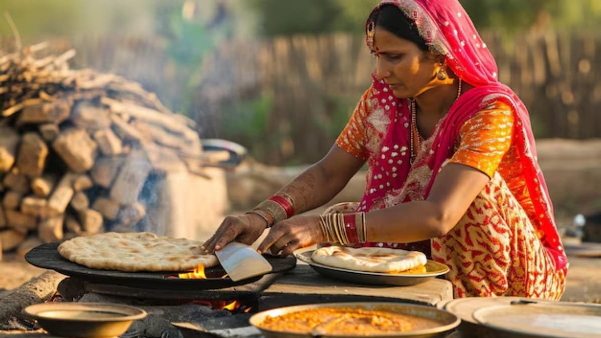 indian woman cooking traditional indian bread big cooking open fire india close
